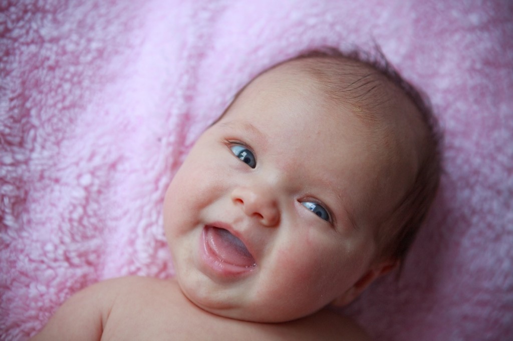 Baby smiling at month 3