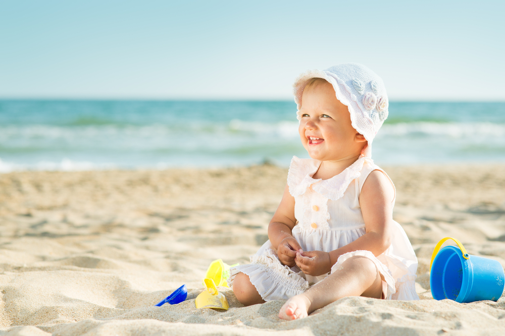 Baby sat on beach