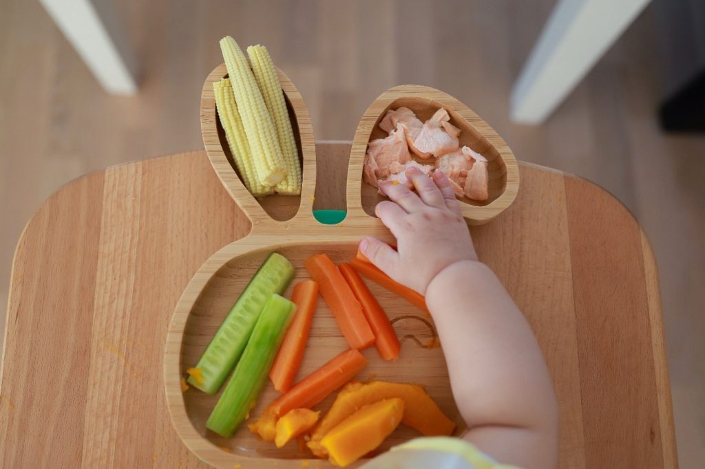 Baby reaching for food