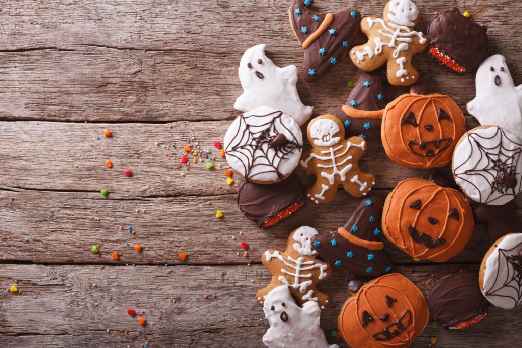 Halloween cookies decorated as ghosts, spiders webs and pumpkins