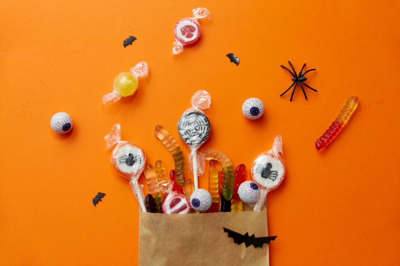 Halloween party favour with sweets inside it in the shape of worms, spiders and eyes