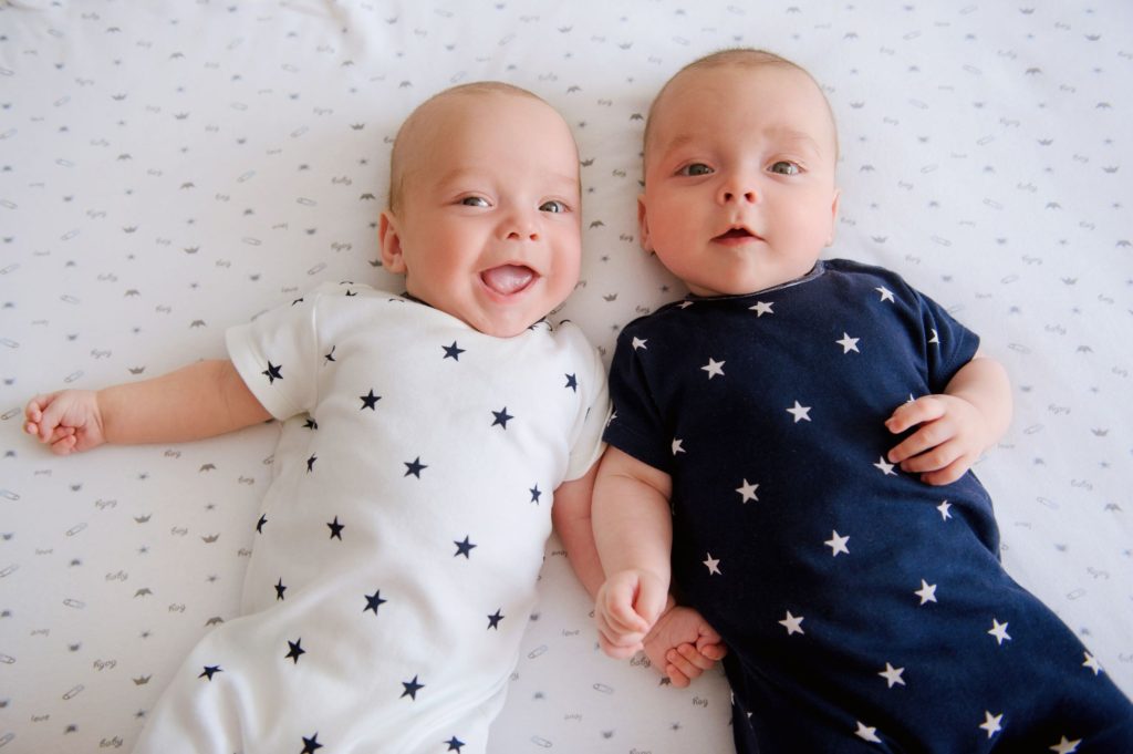 Twin babies in matching onesies 
