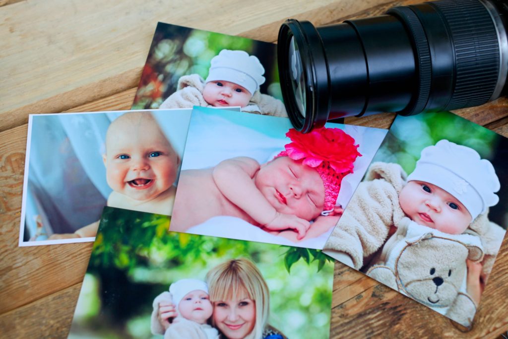 a collection of baby photos and a camera