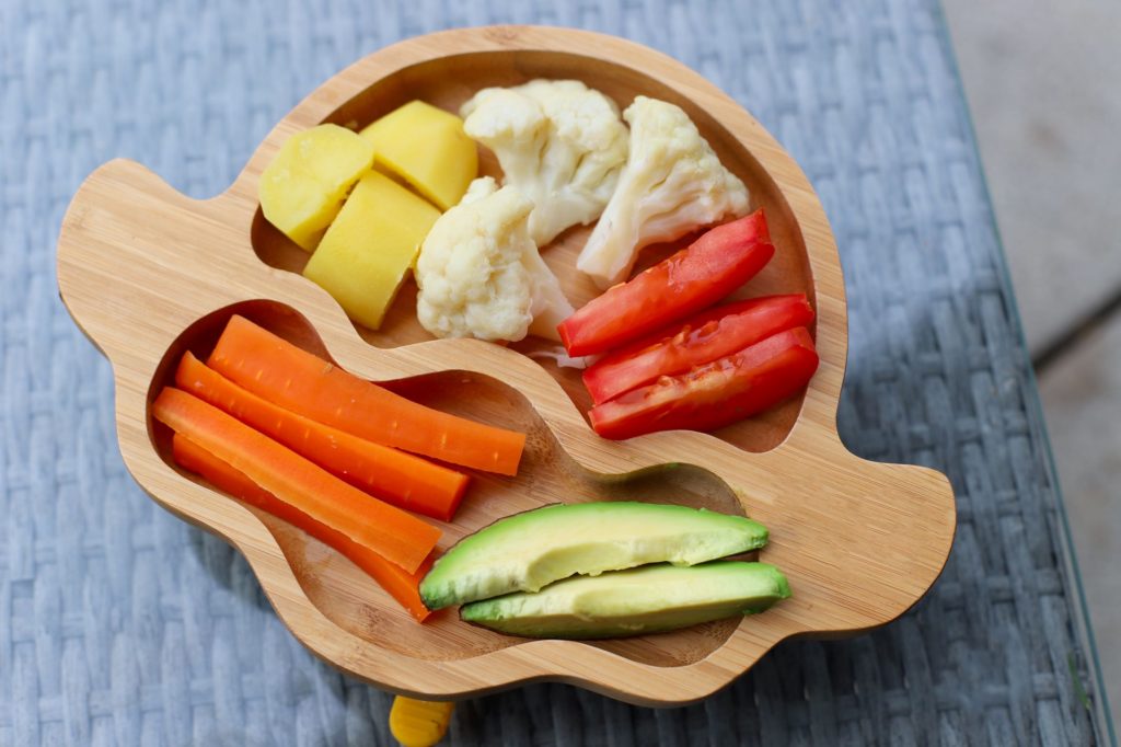 A plate of cut-up vegetables