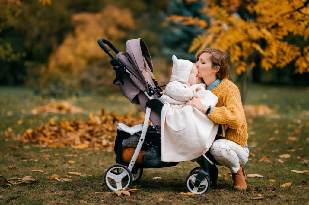 Mum and baby with a pushchair