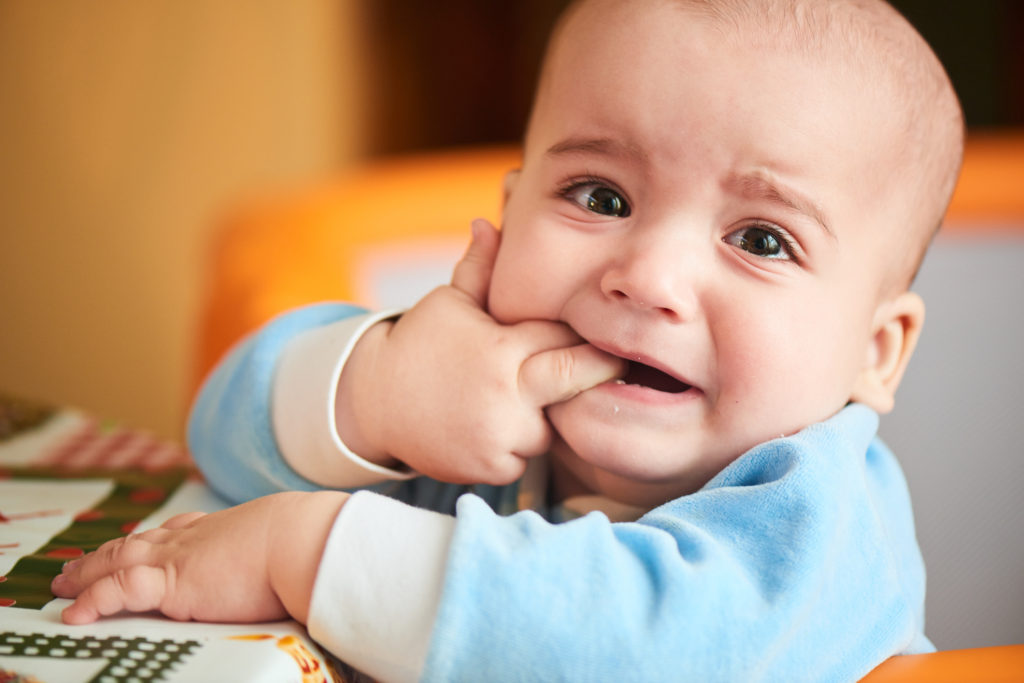 Baby biting fingers because they are teething