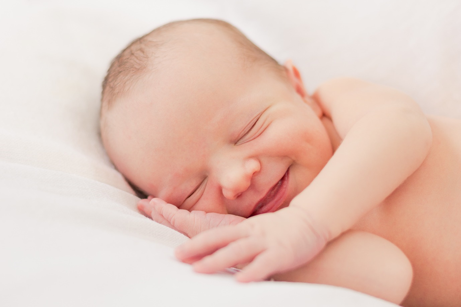 sleeping and smiling baby