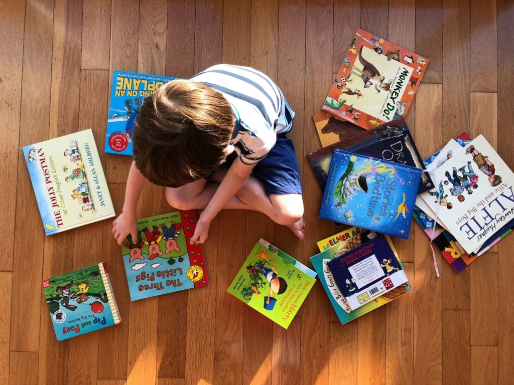 Child playing with books